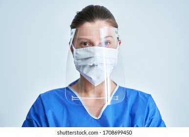 Portrait Of Female Medical Doctor Wearing Protective Mask And Face Shield