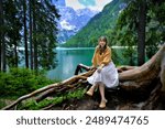 Portrait of female model in Italy during Dolomite summer trip in June 2024. Dolomite Alps mountains, Trentino Alto Adige region, Sudtirol, Dolomites, Italy