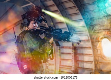 Portrait Of Female Modern Army Special Forces Soldier, Anti Terrorist Squad Fighter, Elite Commando Warrior Using Four-eyed Night Vision Goggles In Dark Background