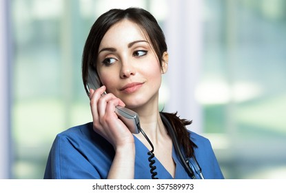 Portrait Of A Female Nurse Talking On The Phone