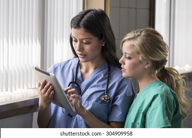 Portrait of female nurses using a tablet
