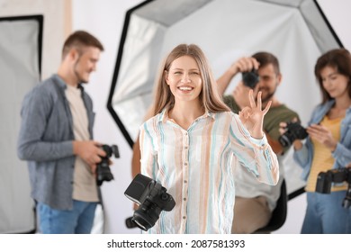 Portrait of female photographer in studio
