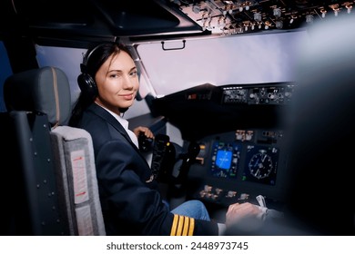 Portrait of a female pilot in the cockpit - Powered by Shutterstock