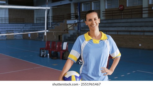 Portrait of female player holding volleyball in the court 4k - Powered by Shutterstock