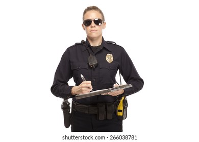 Portrait Of Female Police Officer Writing Report Against White Background