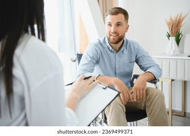 Portrait of female psychiatrist interviewing man during therapy session, copy space - Powered by Shutterstock