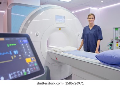 Portrait Of Female Radiographer By MRI Scanner In Hospital