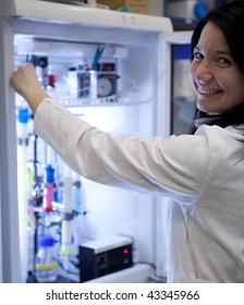 Portrait Of A Female Researcher Carrying Out Research Experiments In A Lab - Researcher Taking A Substance From A Freezer