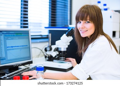 Portrait Of A Female Researcher Doing Research In A Lab (shallow DOF; Color Toned Image)