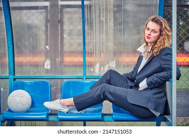 Portrait Of Female Soccer Coach With Ball At The Stadium