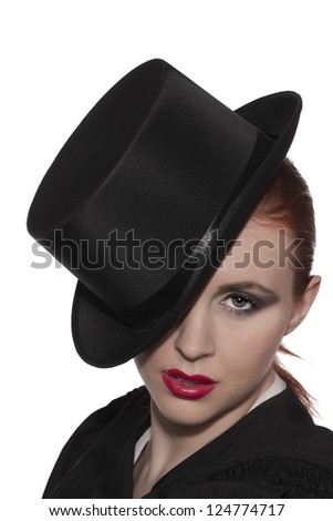 Portrait of a female stage performer wearing a black top hat