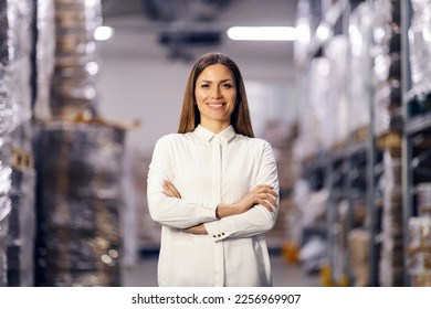 Portrait of female storage manager smiling at the camera. - Powered by Shutterstock