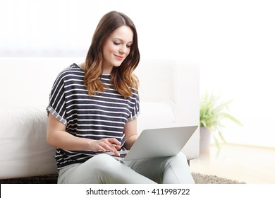 Portrait of female student working on her presentation at home. 