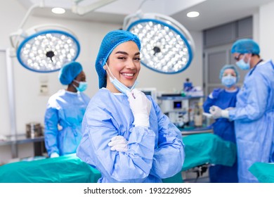 Portrait Of Female Surgeon Standing In Operating Room, Ready To Work On A Patient. Woman Medical Worker Surgical Uniform In Operation Theater.