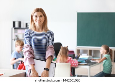 Portrait Of Female Teacher In Classroom