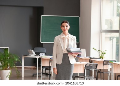 Portrait Of Female Teacher In Classroom