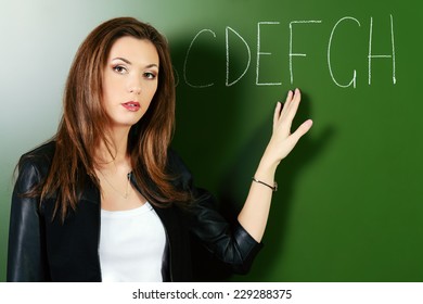 Portrait of a female teacher giving a lesson. Education.