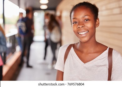 Portrait Of Female Teenage Student On College With Friends
