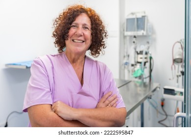 Portrait Of A Female Veterinarian At The Veterinary Clinic, Smiling And Looking At Camera