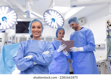 Portrait of female woman nurse surgeon OR staff member dressed in surgical scrubs gown mask and hair net in hospital operating room theater making eye contact smiling pleased happy looking at camera - Shutterstock ID 2281661875
