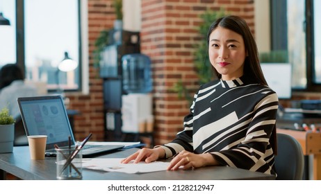 Portrait Of Female Worker Using Recruitment Papers To Start Job Interview With Candidates, Finding Person To Hire For Executive Business Work. HR Employee Looking At Cv For Career Experience.