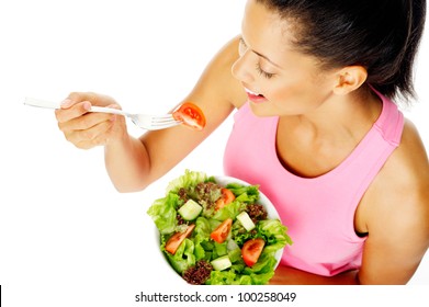 Portrait Of A Fit Healthy Hispanic Woman Eating A Fresh Salad Isolated On White