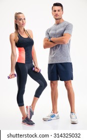 Portrait Of A Fitness Couple Standing Isolated On A White Background