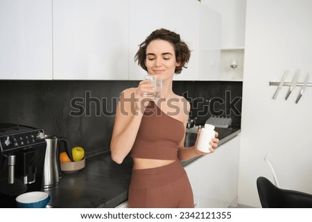 Similar – Image, Stock Photo Young happy woman taking a selfie in front of the mirror