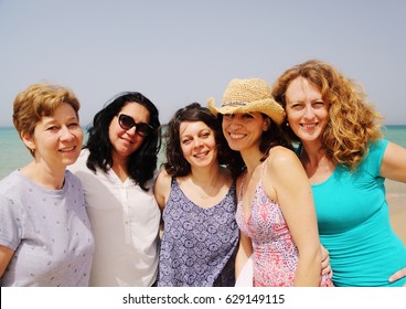 Portrait Of Five  40 Years Old Women Walking On Seaside