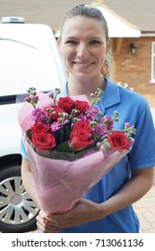 Portrait Of Florist With Van Making Home Delivery Of Bouquet 