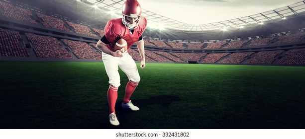 Portrait of focused american football player being ready to attack against rugby stadium - Powered by Shutterstock