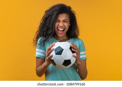 Portrait Of Football Fan Girl With The Ball In Hands Smiling And Saying 