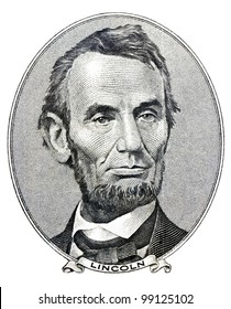 Portrait of former U.S. president Abraham Lincoln as he looks on five dollar bill obverse