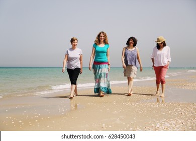 Portrait Of Four  40 Years Old Women On Seaside