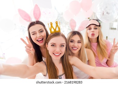 Portrait Of Four Charming Lovely Girls Take Selfie Demonstrate V-sign Eye Wink Pouted Lips Bedroom Indoors