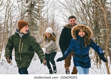 A Portrait Of A Four Family On Forest Winter Season