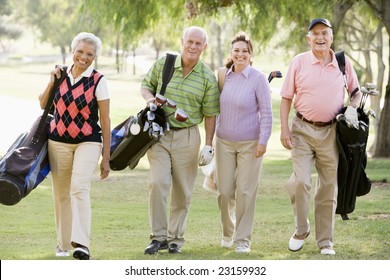 Portrait Of Four Friends Enjoying A Game Golf - Powered by Shutterstock