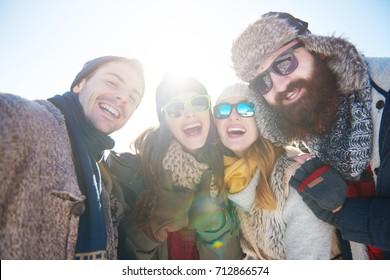 Portrait Of Four Friends In Winter Clothing 


