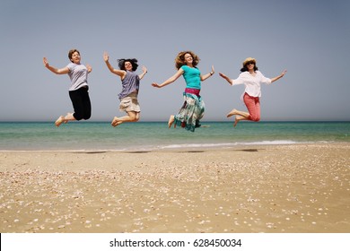 Portrait Of Four40 Years Old Women On Seaside