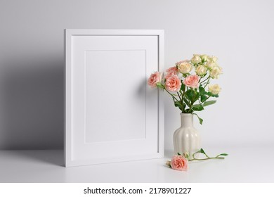 Portrait Frame Mockup In White Interior And Fresh Roses Bouquet, Mockup For Artwork Or Paintings