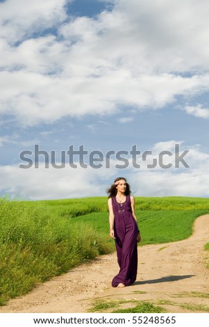 Portrait of the free girl on a background field