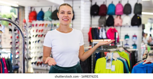 Portrait Of Friendly Female Shop Assistant At Sporting Goods Store