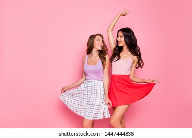 Portrait of friendly nice pretty charming nice youth person have holidays summer wear modern skirt stylish dress stretch raise hands arms wavy curly long hairdo isolated pink background