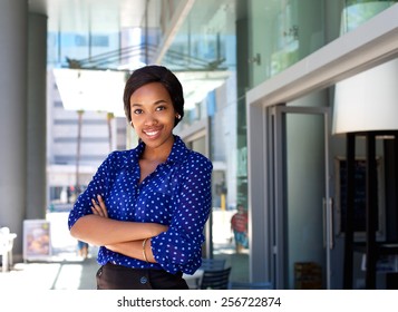 Portrait Of A Friendly Smiling Business Woman Standing Outside In The City