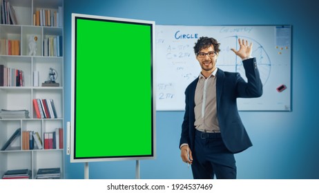 Portrait of Friendly Teacher Explains Lesson to a Classroom, Uses Green Screen Digital Whiteboard. Successful Businessman Talks about Project Growth Uses Chroma Key Digital Blackboard - Powered by Shutterstock