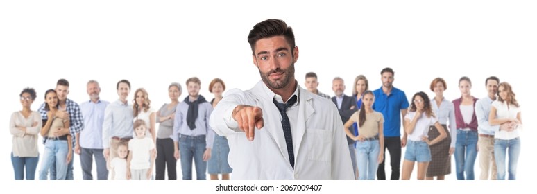 Portrait Of Friendly Therapist Doctor Pointing At You And Looking At Camera With Smile Crowd Many Casual People On Background, Isolated On White