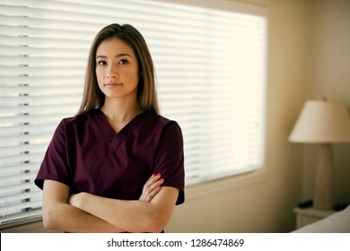 Portrait of a friendly young nurse at a rest home. - Shutterstock ID 1286474869