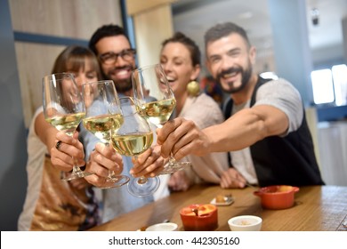 Portrait Of Friends In A Bar Drinking Wine