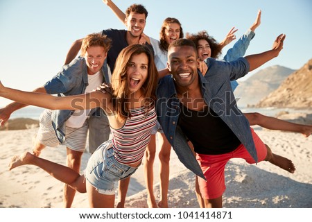 Portrait Of Friends Having Fun Together On Beach Vacation
