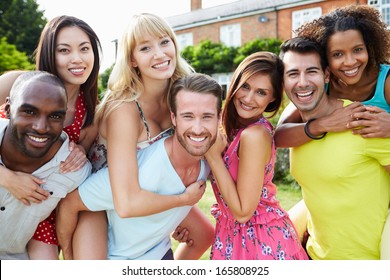 Portrait Of Friends Relaxing In Summer Garden Together - Shutterstock ID 165808925